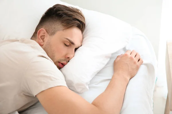 stock image Handsome man sleeping in bed at home