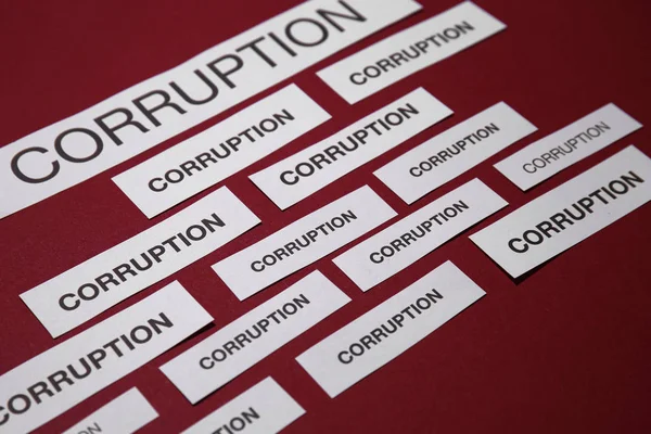 Pieces Paper Words Corruption Red Background — Stock Photo, Image