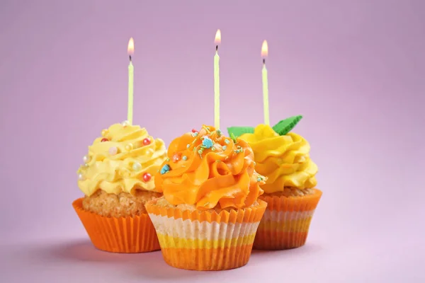 Tasty Birthday Cupcakes Burning Candles Color Background — Stock Photo, Image