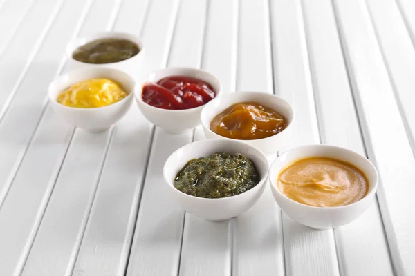 Different Tasty Sauces Bowls White Wooden Table — Stock Photo, Image