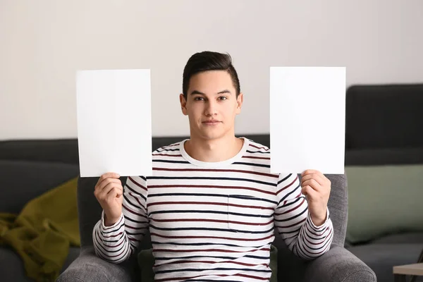 Young Man Blank Sheets Paper Sitting Armchair Home — Stock Photo, Image