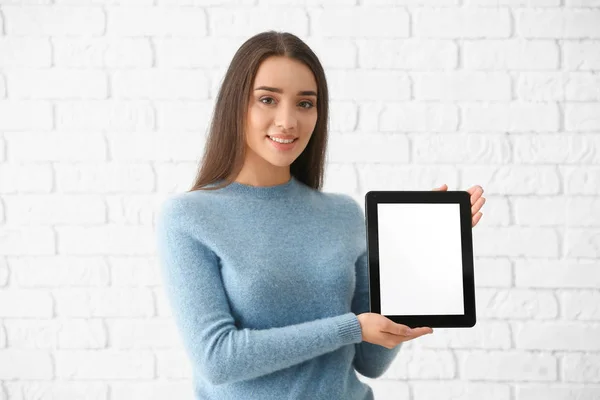 Young Woman Tablet Computer White Brick Wall — Stock Photo, Image