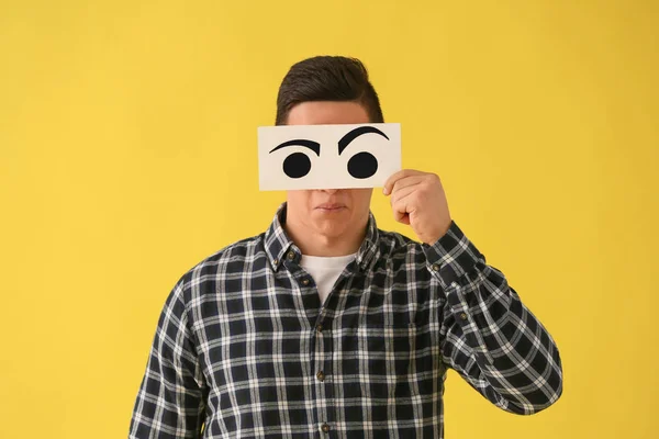 Emotional Young Man Hiding Face Sheet Paper Drawn Eyes Color — Stock Photo, Image