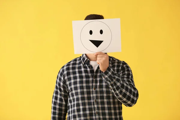 Man Hiding Face Sheet Paper Drawn Emoticon Color Background — Stock Photo, Image