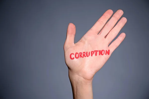 Female Palm Written Word Corruption Grey Background — Stock Photo, Image