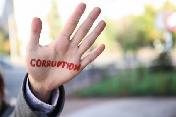 Woman Word Corruption Written Her Palm Outdoors — Stock Photo, Image