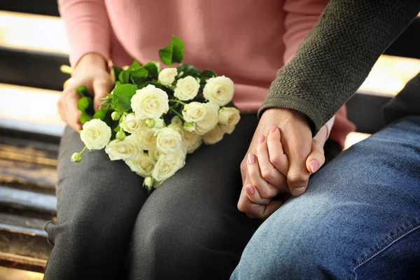 Loving Young Couple Holding Hands While Sitting Wooden Bench Outdoors — Stock Photo, Image