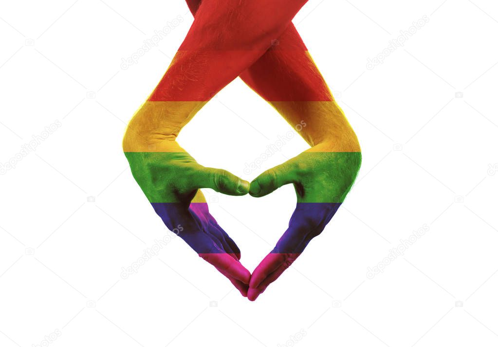 Male hands painted as the rainbow flag making heart on white background. LGBT concept