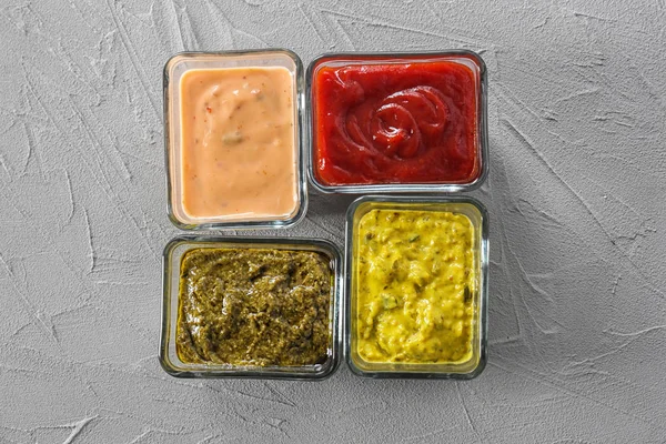 Different Tasty Sauces Bowls Grey Background — Stock Photo, Image