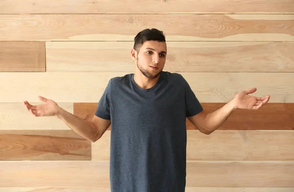 Emotional Young Man Making Mistake Wooden Background — Stock Photo, Image