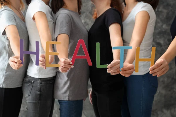 Women Letters Forming Word Health Grey Background — Stock Photo, Image