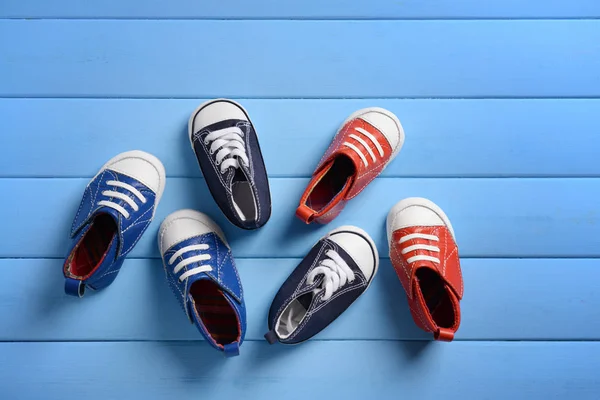 Baby Shoes Blue Wooden Background — Stock Photo, Image