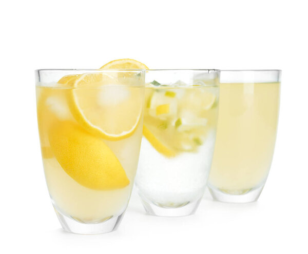 Glasses with cool fresh lemonade on white background