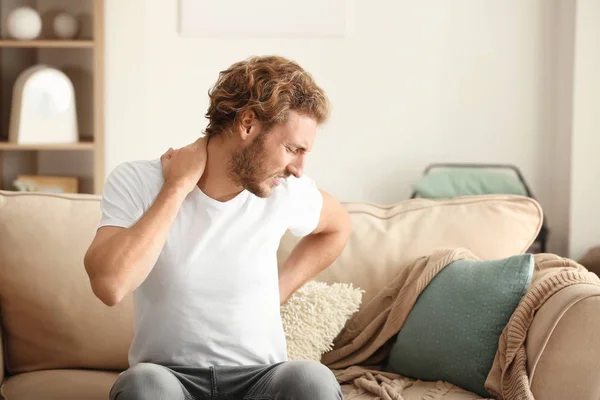 Young Man Suffering Back Pain Home — Stock Photo, Image