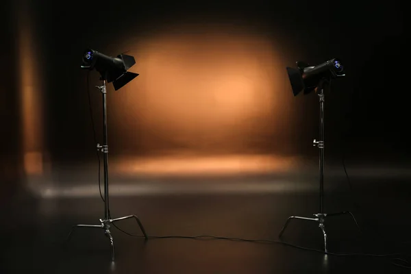 Professional lighting equipment on dark background