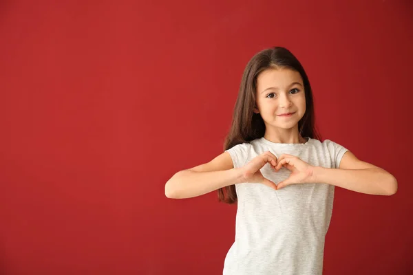 Cute Girl Shirt Making Heart Her Hands Color Background — Stock Photo, Image