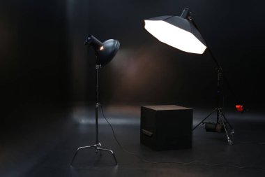 Professional lighting equipment on dark background clipart
