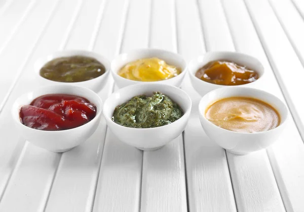 Different Tasty Sauces Bowls White Wooden Table — Stock Photo, Image