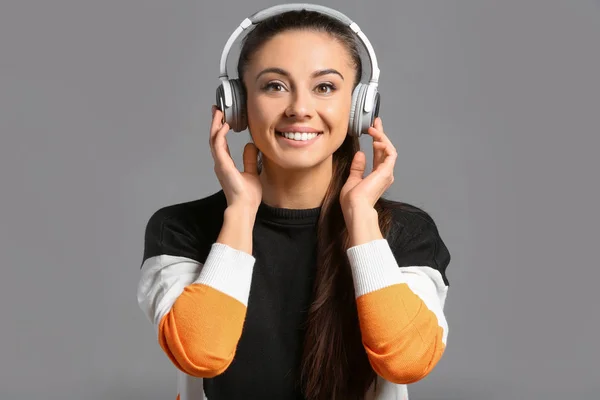 Beautiful Woman Listening Music Grey Background — Stock Photo, Image