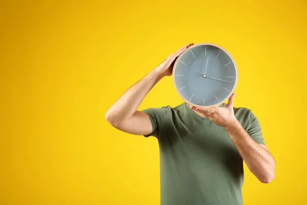 Young Man Clock Color Background — Stock Photo, Image