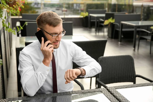 Businessman Looking His Watch While Talking Phone Cafe — Stock Photo, Image