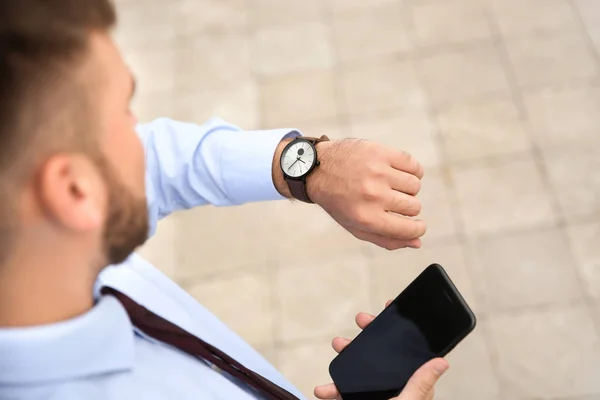 Businessman Looking His Watch Outdoors — Stock Photo, Image