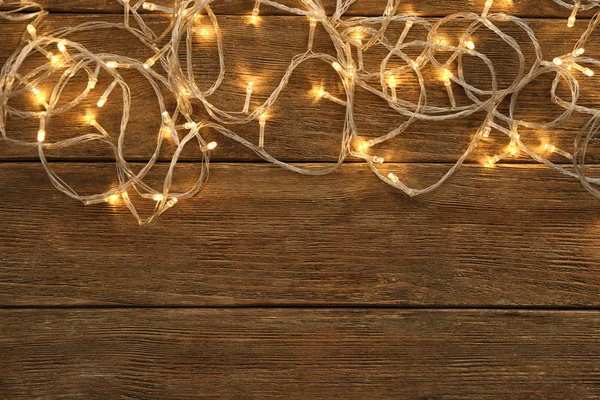 Glowing Christmas Lights Wooden Table — Stock Photo, Image