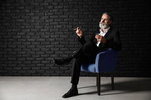 Senior Man Drinking Whiskey Smoking Cigar Dark Brick Wall — Stock Photo, Image