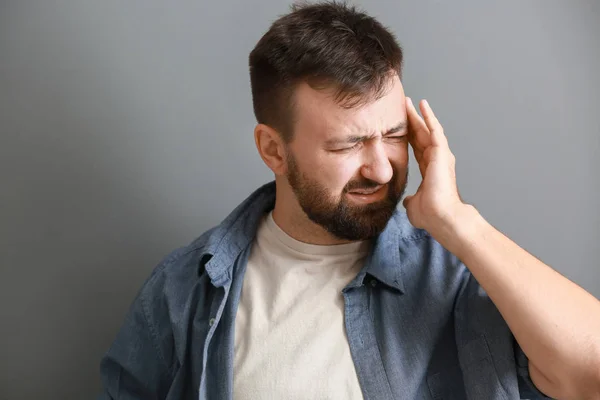 Man Suffering Headache Grey Background — Stock Photo, Image