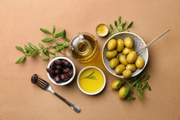 Composition with olive oil on color background