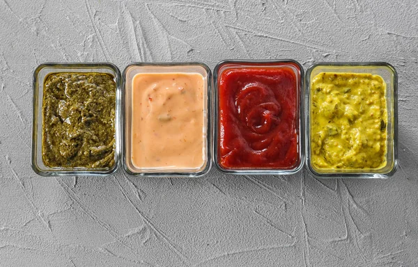 Different Tasty Sauces Bowls Grey Background — Stock Photo, Image