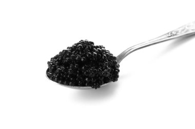 Spoon with delicious black caviar on white background clipart