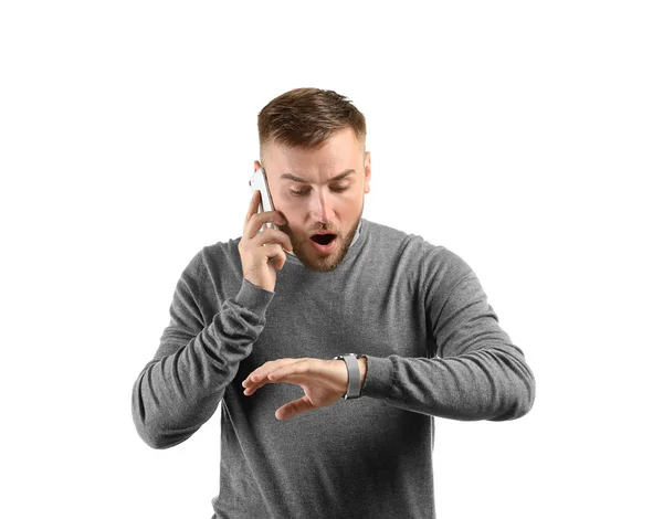 Emotional Man Looking His Watch While Talking Phone White Background — Stock Photo, Image