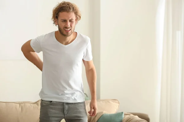 Young Man Suffering Back Pain Home — Stock Photo, Image