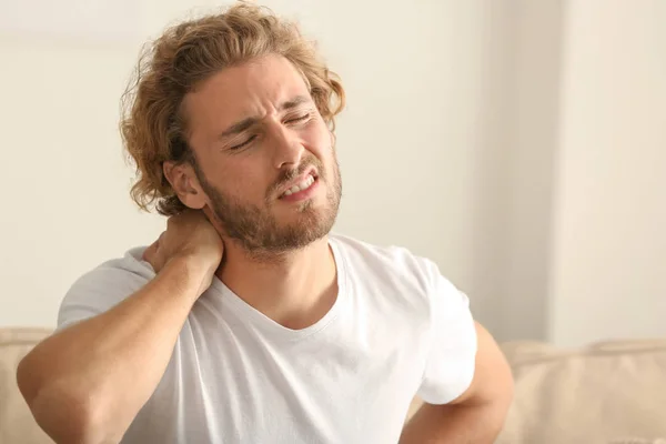 Young Man Suffering Neck Pain Home — Stock Photo, Image