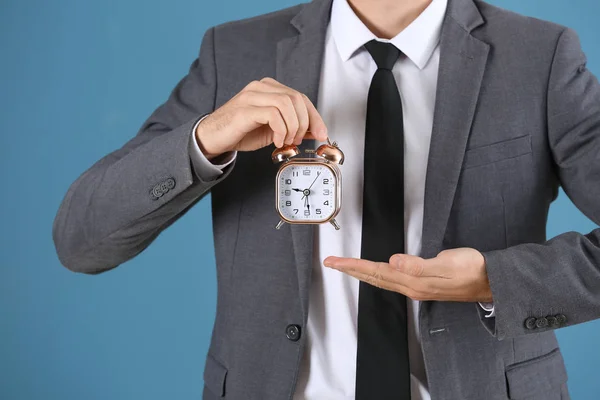 Young Businessman Alarm Clock Blue Background — Stock Photo, Image