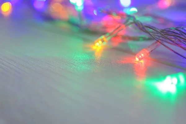 輝くクリスマス ライト テーブル クローズ アップの — ストック写真