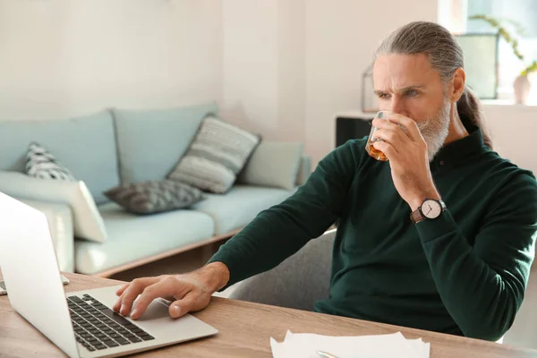 Senior Man Drinking Whiskey While Working Laptop Home — Stock Photo, Image