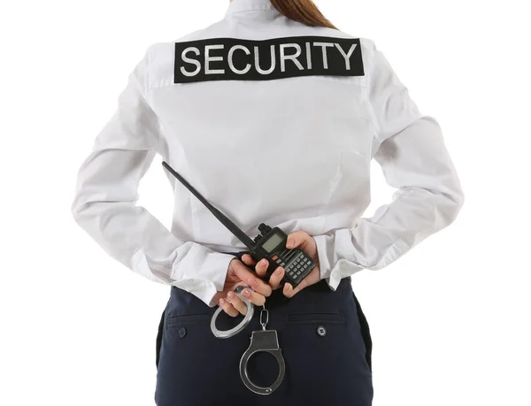 携帯用無線送信機と白い背景の手錠女性警備員 — ストック写真