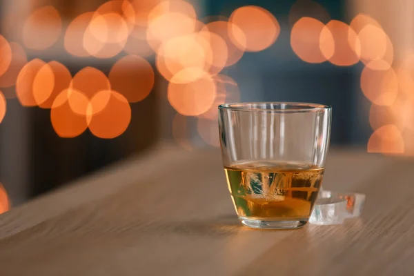 Glass Whiskey Wooden Table Blurred Lights — Stock Photo, Image