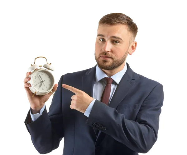 白い背景の上の目覚まし時計を持ったビジネスマン — ストック写真