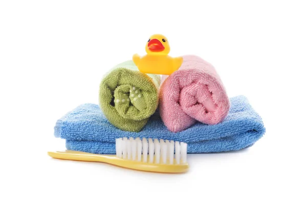 stock image Towels and brush and toy on white background