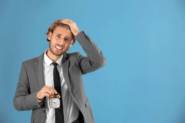 Stressed Businessman Alarm Clock Blue Background — Stock Photo, Image