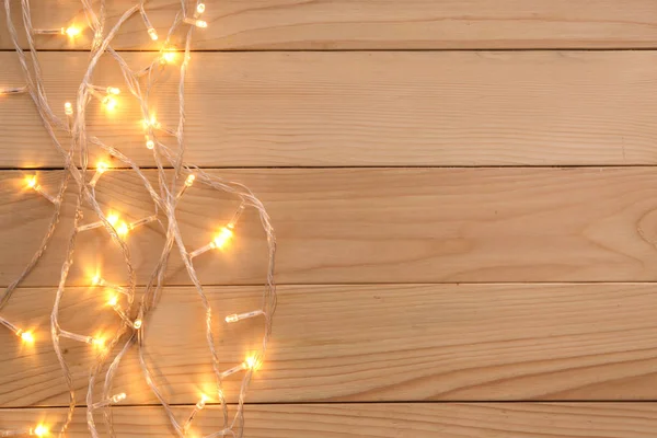 Glowing Christmas Lights Wooden Table — Stock Photo, Image