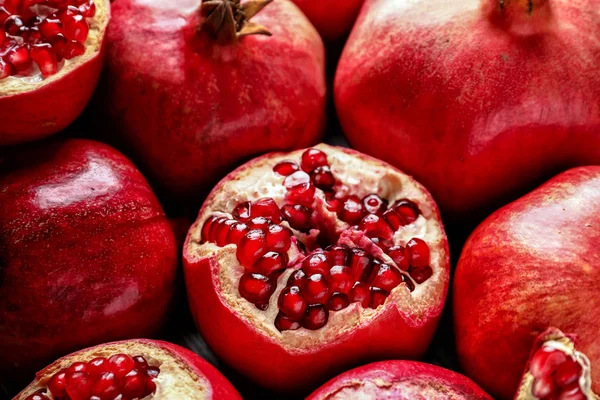 Many ripe pomegranates as background