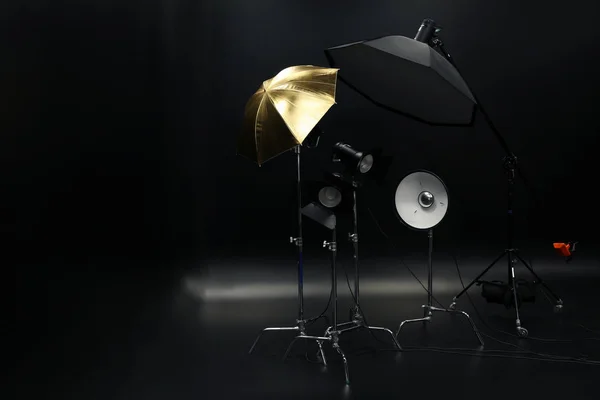 Professional lighting equipment on dark background