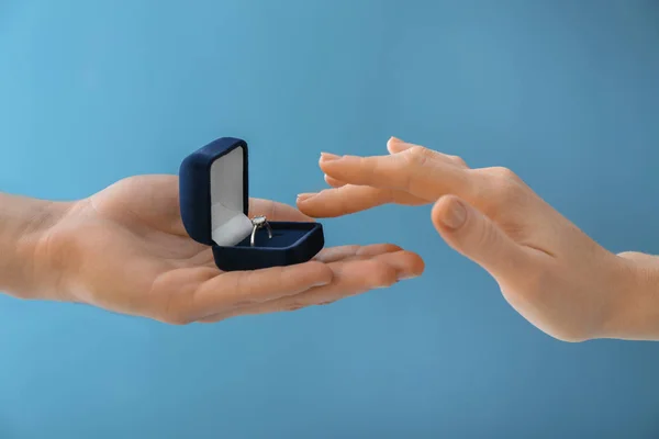 Young Man Proposing His Beloved Color Background Closeup — Stock Photo, Image