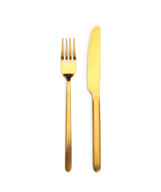 Altın çatal ve bıçak beyaz arka plan üzerinde