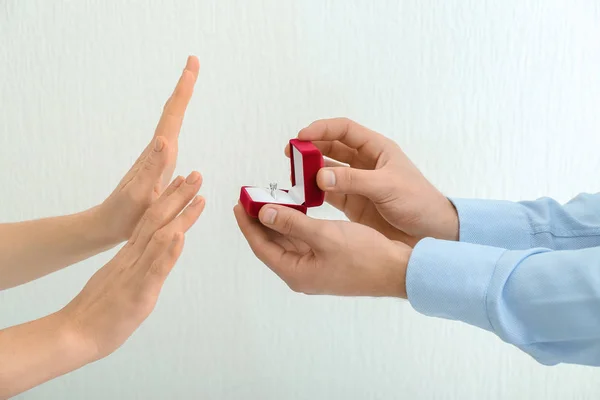 Young Woman Rejecting Marriage Proposal Light Background — Stock Photo, Image