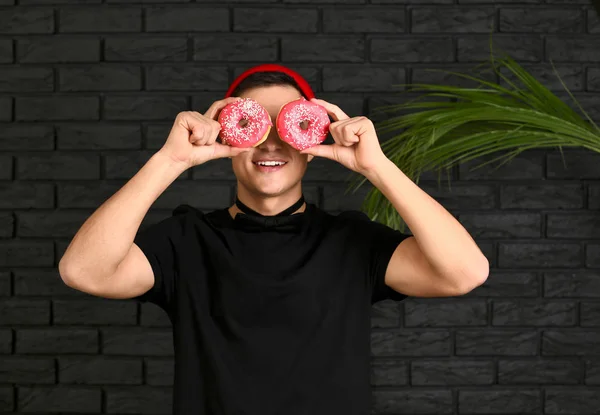 Young Man Tasty Donuts Dark Background — Stock Photo, Image